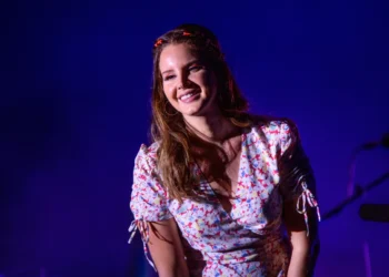 Lana Del Rey performing on stage at the Festival Internacional de Benicassim (FIB) in Benicassim, Spain, on July 19, 2019, wearing a floral dress.