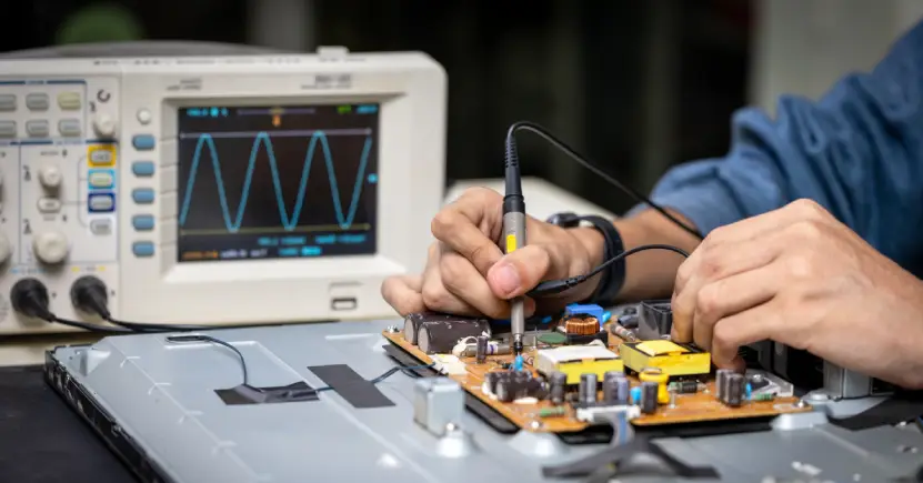 Stock image working on electronics