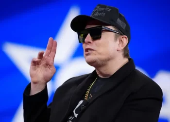 Elon Musk raising his fingers